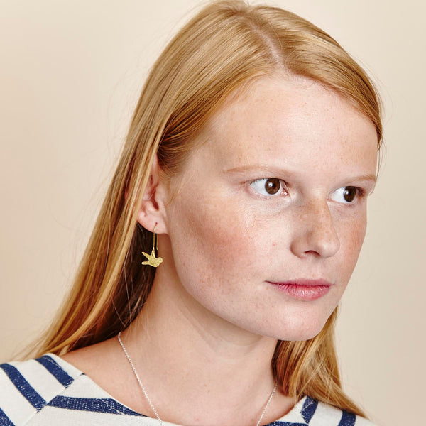 Hammered brass swallow earrings
