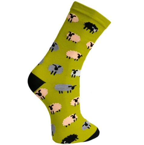 Fair trade green bamboo socks with pink, white, black and grey/blue sheep and black heels and toes.