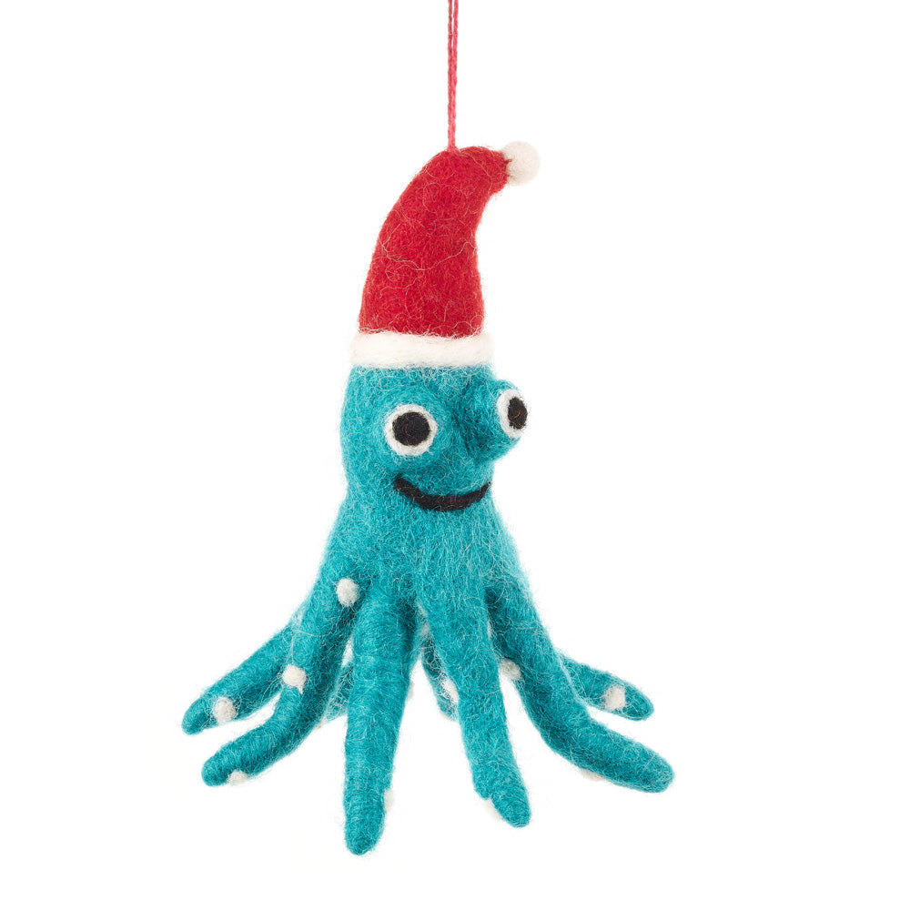 Blue felt octopus decoration with white suckers wearing a red Santa hat