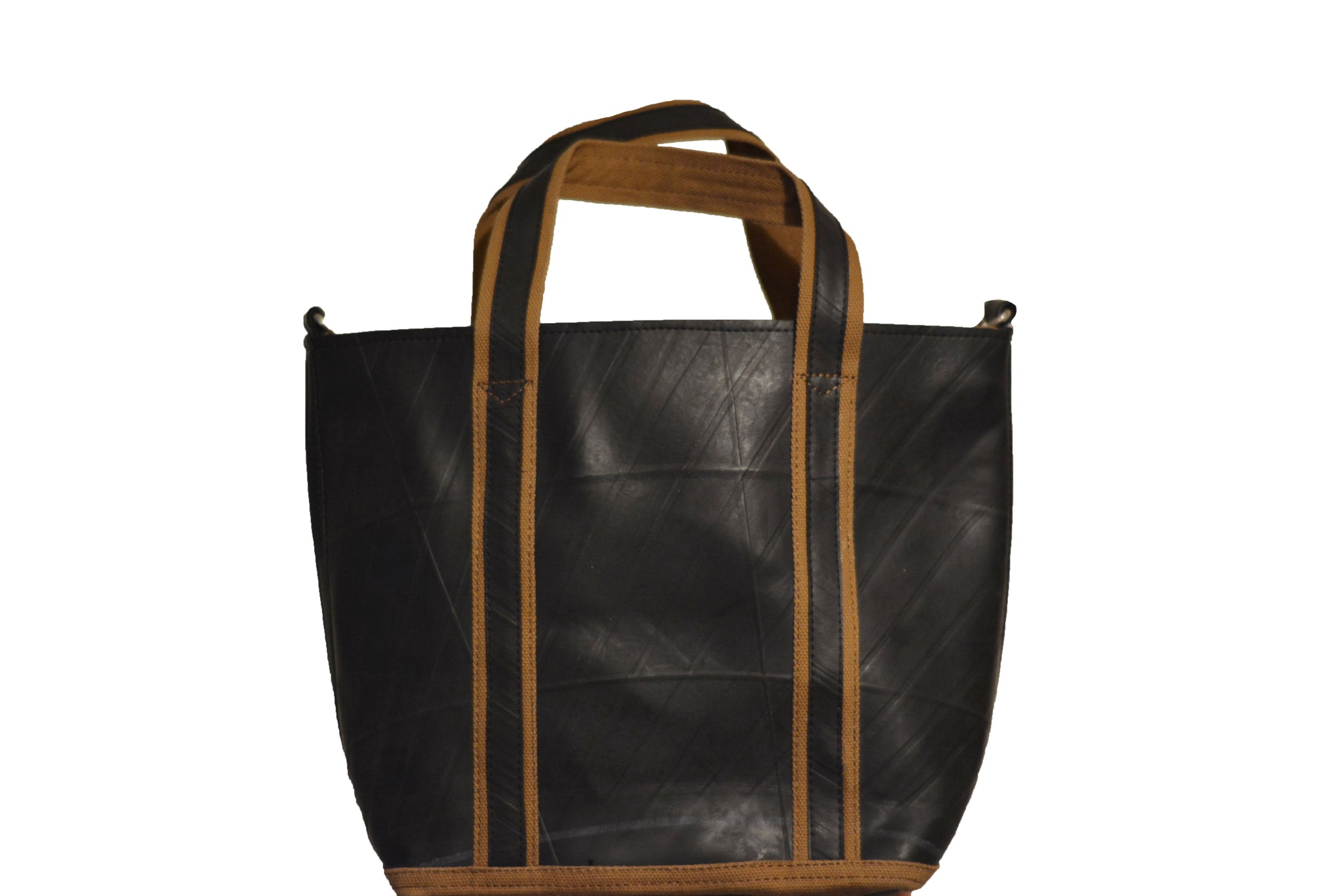 Front view of a fair trade recycled tyre tote bag. The bag is black with a texture from the tyre tread and mustard trim around the bottom of the bag and edging the straps.