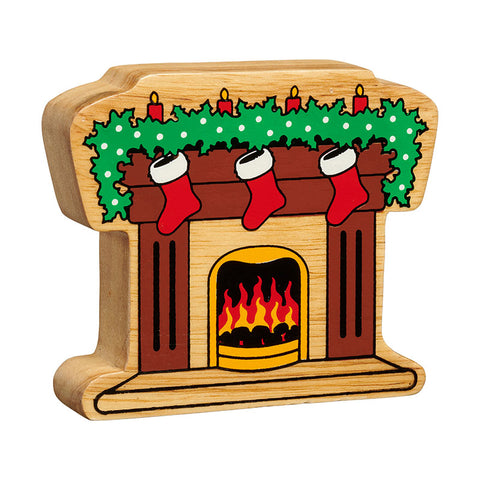 A fireplace handpainted on chunky natural wood with the grain showing. The brown fireplace is over a yellow fire and is decorated with green holly, red candles and red and white stockings