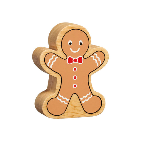 A gingerbread man figure handpainted on chunky natural wood with the grain showing. It is brown with white icing decoration and red buttons and bow tie