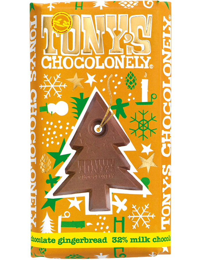 Tony's Chocolonely milk chocolate gingerbread bar in an orange wrapper with green, white and gold Christmas designs and a picture of the Christmas tree shaped centre of the Fairtrade and slavery free milk chocolate bar