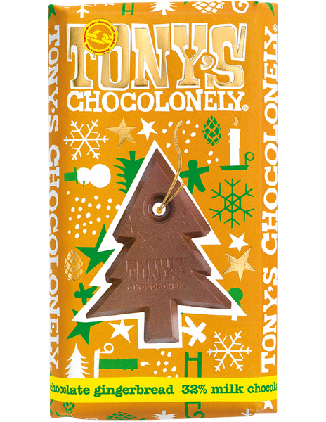 Tony's Chocolonely milk chocolate gingerbread bar in an orange wrapper with green, white and gold Christmas designs and a picture of the Christmas tree shaped centre of the Fairtrade and slavery free milk chocolate bar