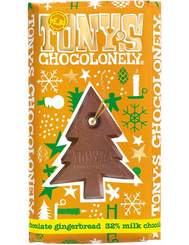Tony's Chocolonely milk chocolate gingerbread bar in an orange wrapper with green, white and gold Christmas designs and a picture of the Christmas tree shaped centre of the Fairtrade and slavery free milk chocolate bar