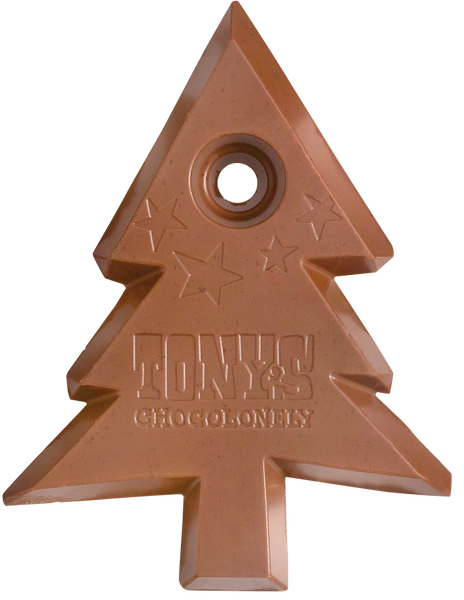 The Christmas tree shaped centre of the Fairtrade and slavery free Tony's Chocolonely milk chocolate gingerbread bar. It has the Tony's logo and four stars embossed on the chocolate