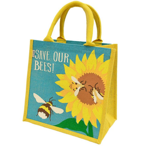 Fair trade eco-friendly jute bag in bright yellow  with a pattern of screen printed blue sky, a yellow and brown sunflower and 3 brown, yellow and white bees. The writing on the bag says 'save our bees'