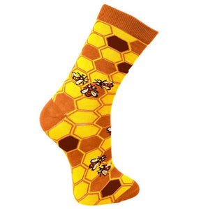 Fair trade bamboo socks with a yellow, light brown and dark brown honeycomb pattern and yellow, black and white bees and brown heels and toes 