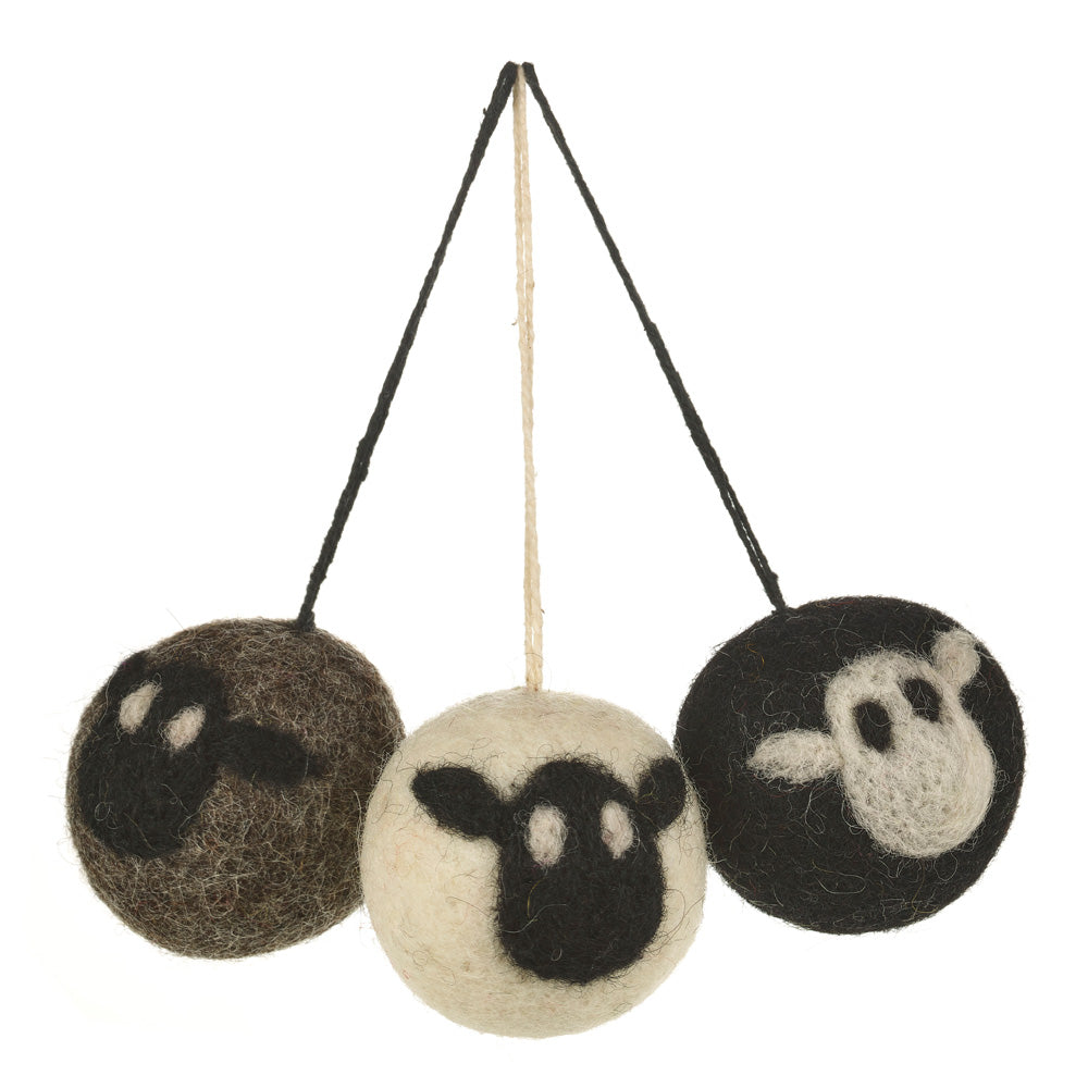 Set of three round sheep baubles in grey, black and white with contrasting black or white faces