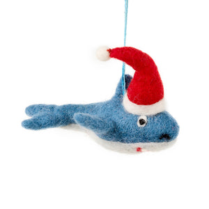 Blue felt shark decoration wearing a red Santa hat