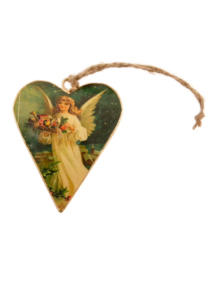 A heart shaped Christmas decoration showing a vintage picture of an angel carrying stocking fillers. Main colours are ivory and dark blue